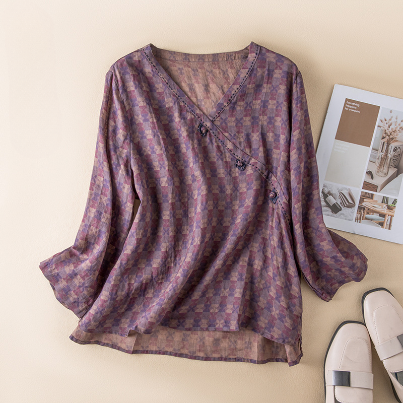 Lightweight, flowy women's patterned crossover blouse, relaxed fit for elegant summer wear.