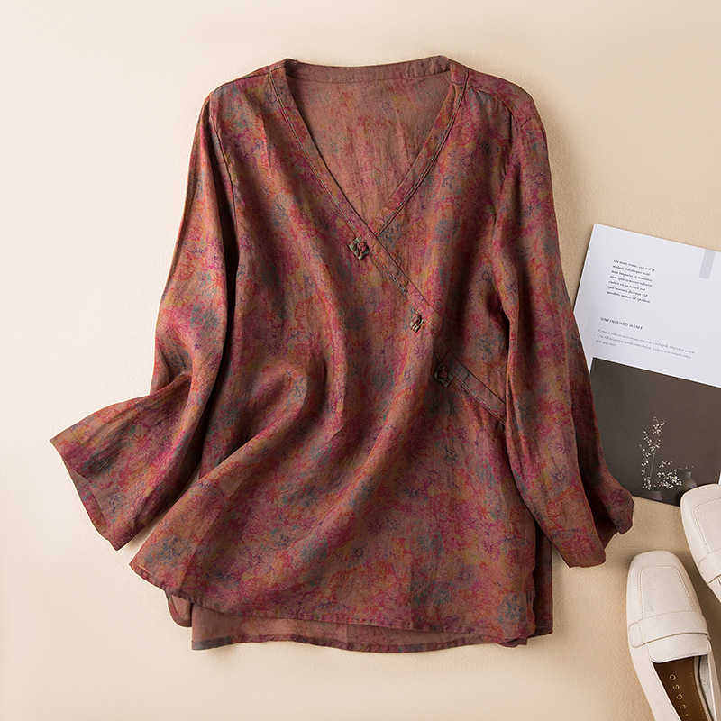 Chic women's breezy patterned tunic blouse, crossover style for spring fashion and comfort.