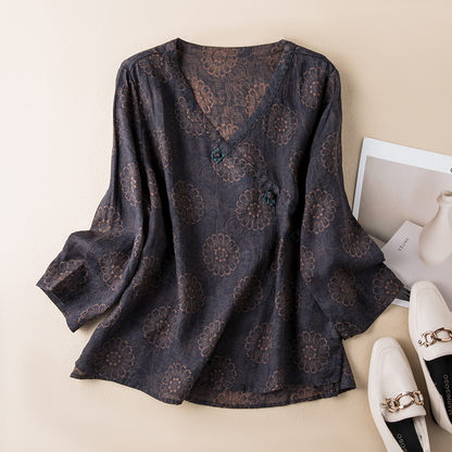 Delicate pattern on a lightweight, flowy women's crossover top, ideal for breezy summer days.