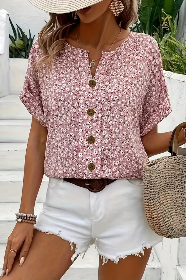 Women's breezy floral blouse, perfect for summer. Lightweight short-sleeve top for casual wear & vacation fashion.