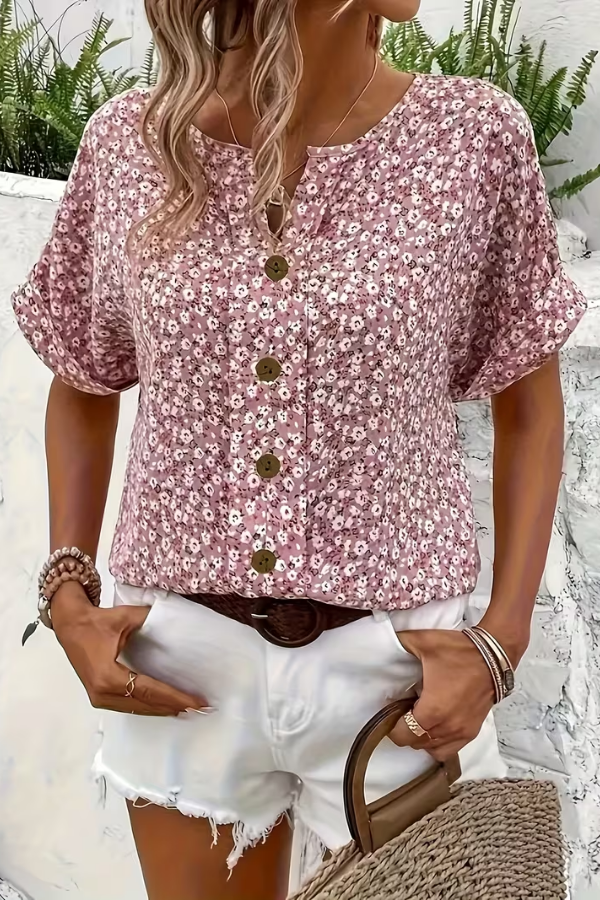 Chic women's short-sleeve floral blouse for a breezy summer look. Ideal lightweight top for casual and vacation style.