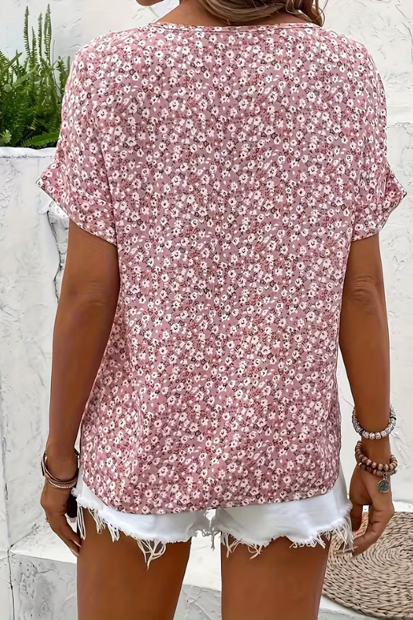 Stylish women's floral summer blouse, perfect for vacation or casual wear. Enjoy the breezy, lightweight short-sleeve top.