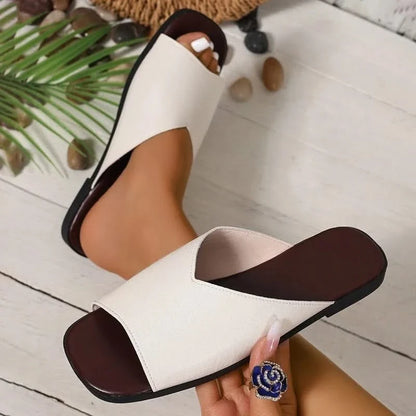 Detail of cushioned sole on women's breezy open-toe flats, ensuring summer comfort & support.