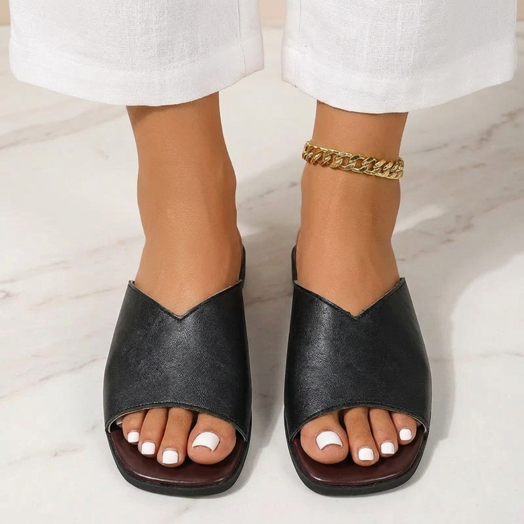 Cushioned slip-on women's flats, breezy open-toe design for casual summer footwear comfort.