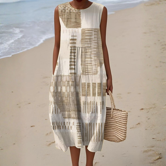 Women's breezy sleeveless midi dress featuring vibrant abstract print, perfect for summer fashion & vacation outfits.