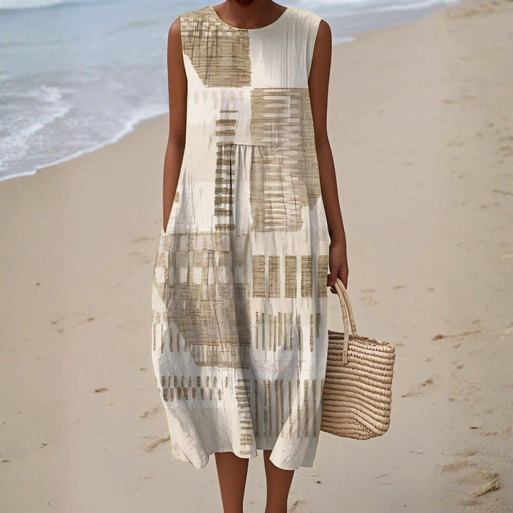 Women's breezy sleeveless midi dress featuring vibrant abstract print, perfect for summer fashion & vacation outfits.
