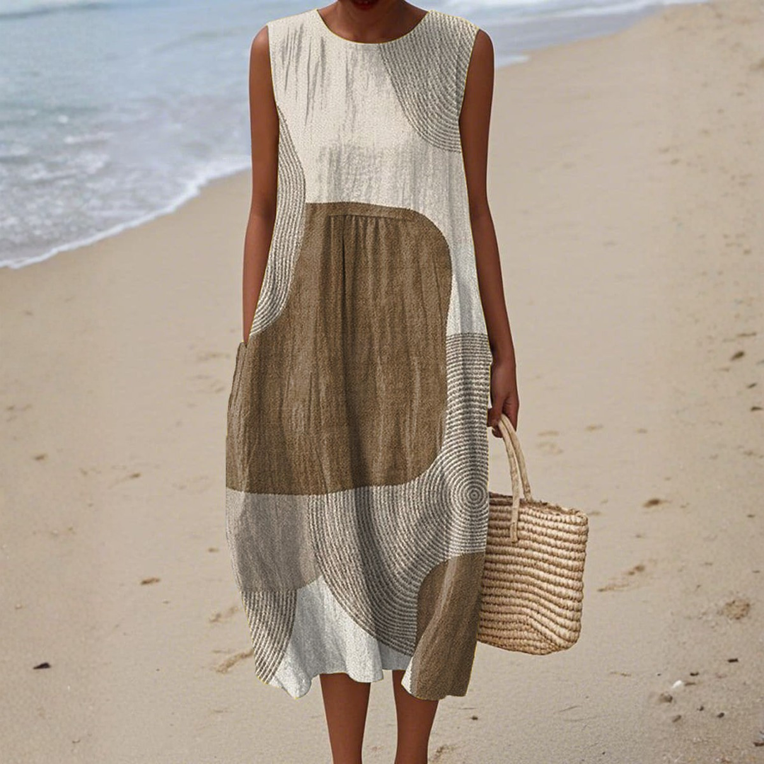 Elegant women's flowy abstract print sleeveless midi dress for ultimate summer comfort and casual day wear.