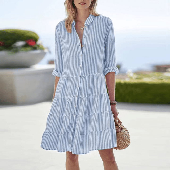 Comfortable women's breezy striped maxi dress. Flowy summer style, perfect for casual outings or elegant vacation wear.