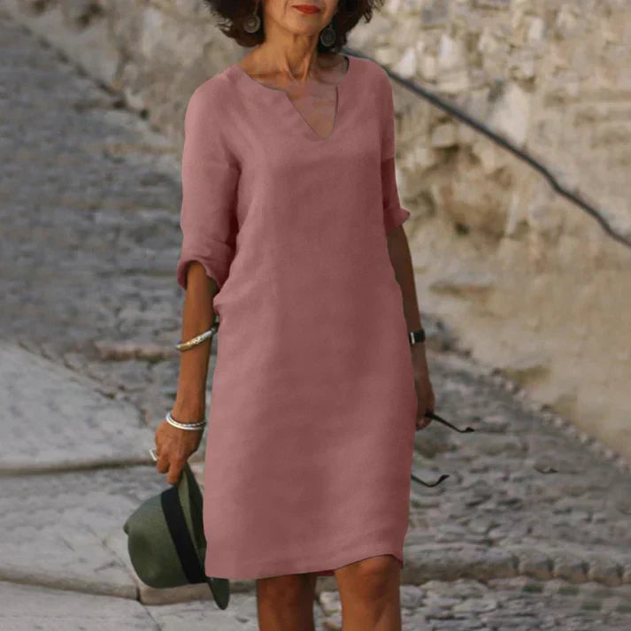 Women's breezy V-neck midi dress, perfect for summer comfort & everyday style.