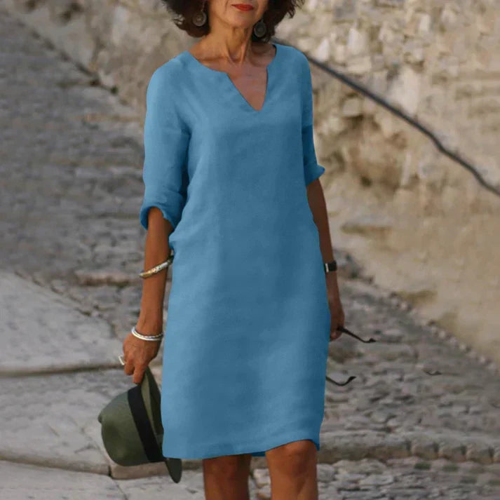 Women's comfortable V-neck midi dress, ideal for vacation outfits & relaxed summer style.