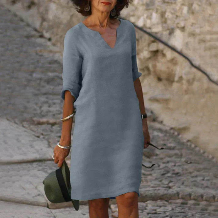 Flowing skirt of a women's breezy V-neck midi dress, perfect for effortless summer fashion.