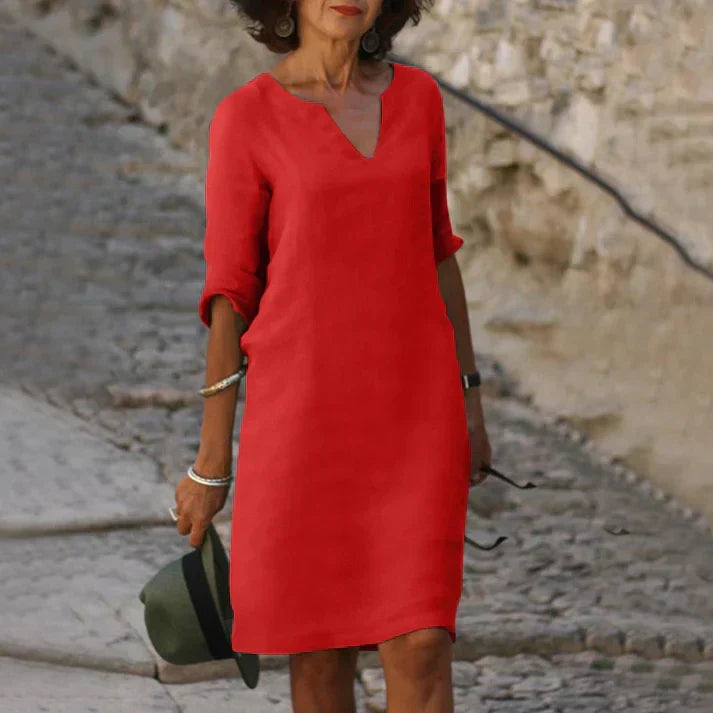 Detailed view of the V-neckline on a comfortable women's midi dress, summer casual wear.