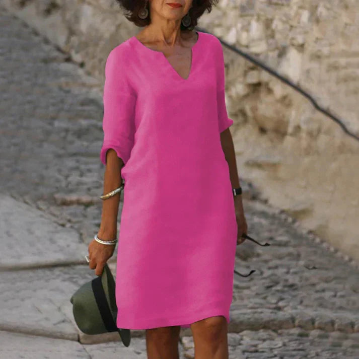 Comfortable, flowing V-neck midi dress for women, ideal for spring & summer casual wear.