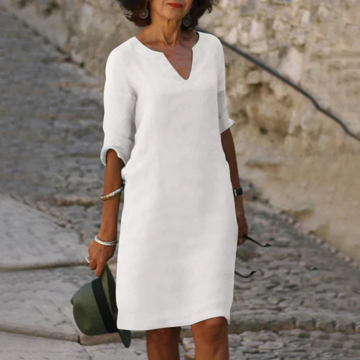 Elegant sleeveless midi dress for women, V-neck, suitable for vacation & summer fashion.