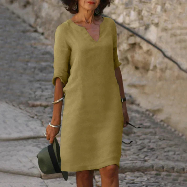 Back view of a women's comfortable V-neck midi dress, perfect for relaxed summer style.