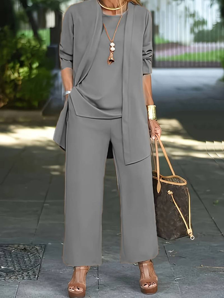 Women's casual 3-piece outfit featuring wide-leg trousers, a matching top, and a lightweight cardigan.
