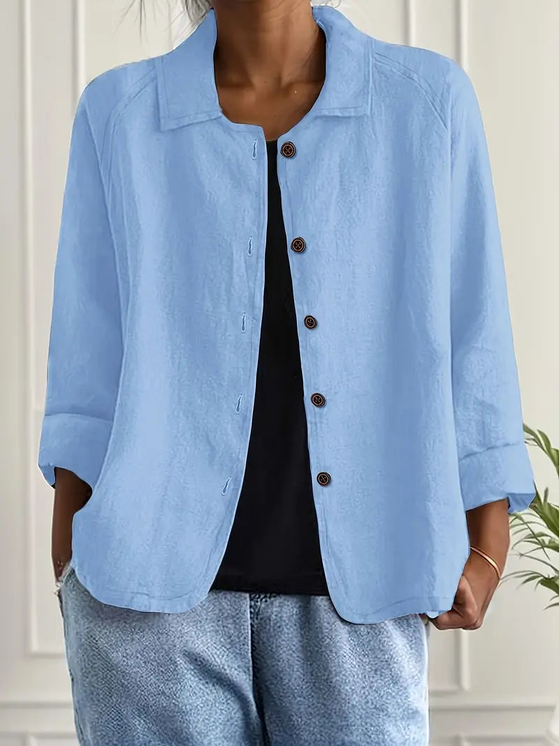 Women's button-front casual top, relaxed fit for everyday wear. Three-quarter sleeve, versatile spring fashion.