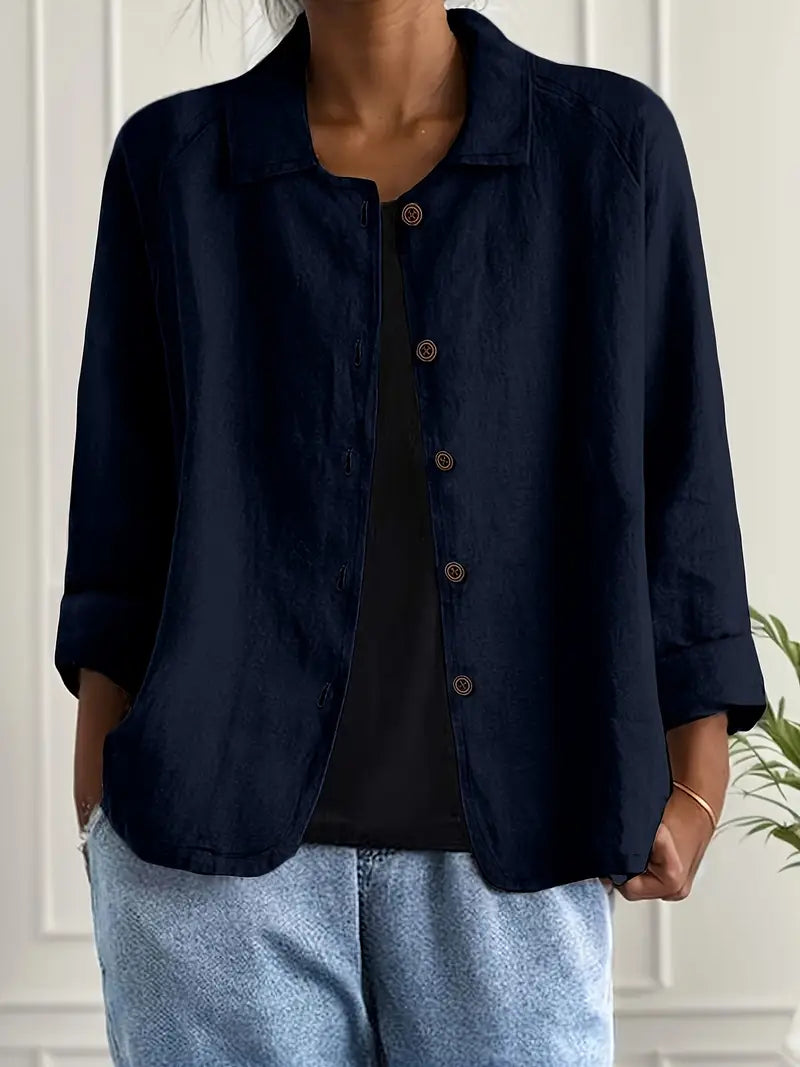 Stylish women's relaxed fit top, button-front, three-quarter sleeves. Versatile for spring/summer casual wear.