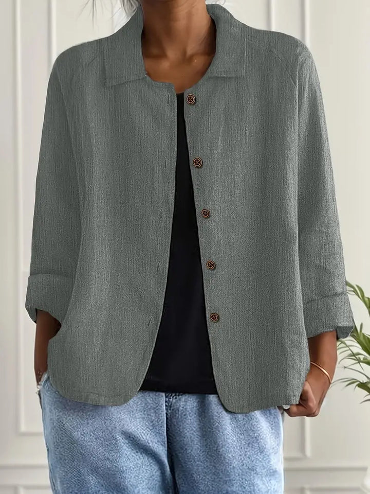 Front view of women's button-front casual top, relaxed fit, three-quarter sleeves. Everyday & work leisure wear.