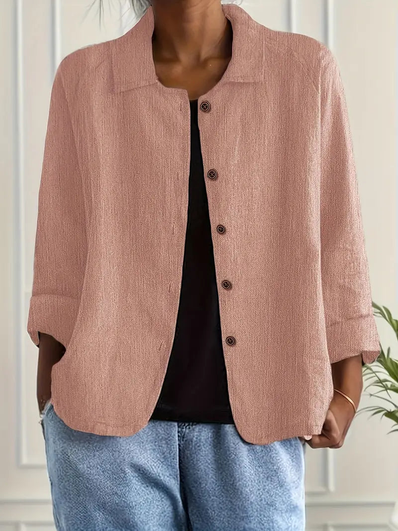 Chic women's relaxed fit button-front top with three-quarter sleeves. Perfect for casual, work, or summer.