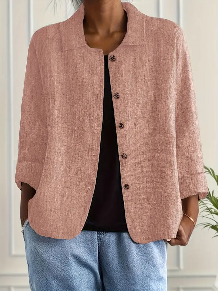 Chic women's relaxed fit button-front top with three-quarter sleeves. Perfect for casual, work, or summer.