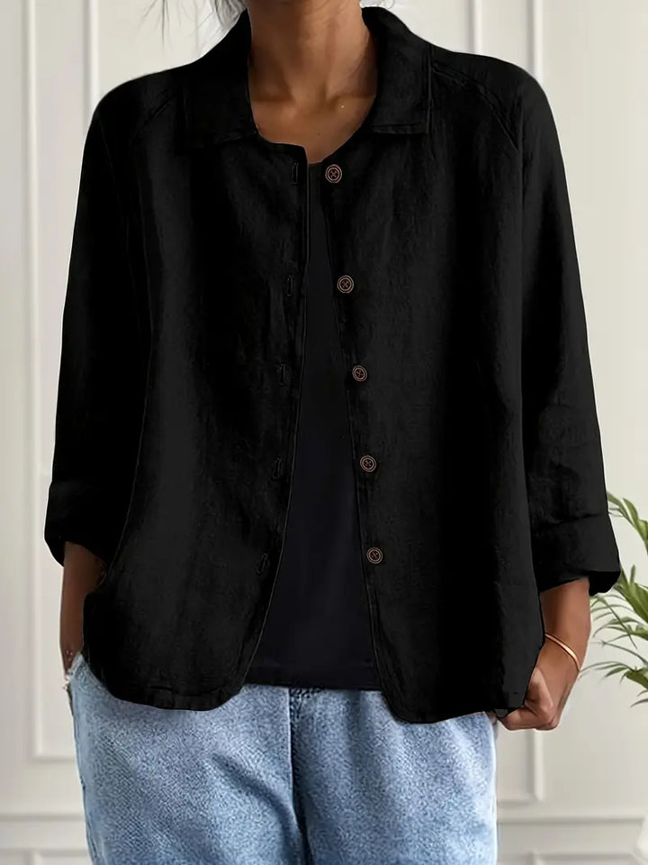 Versatile women's button-front top, relaxed fit, three-quarter sleeves. Great for casual, work, or daily wear.