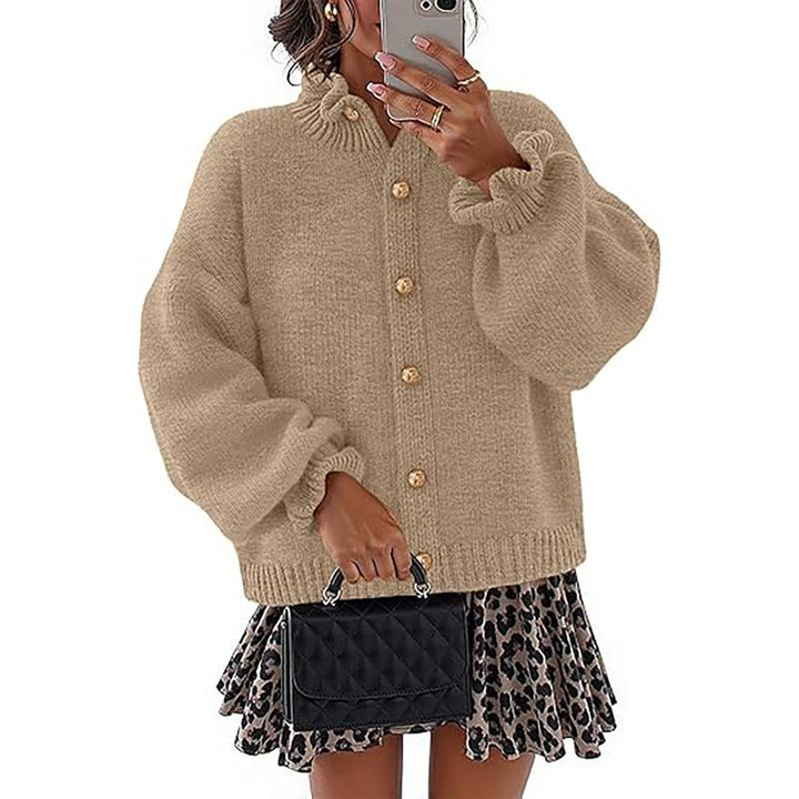 Fashionable women's buttoned cardigan, perfect for seasonal wear. Comfortable long sleeve knitwear top.