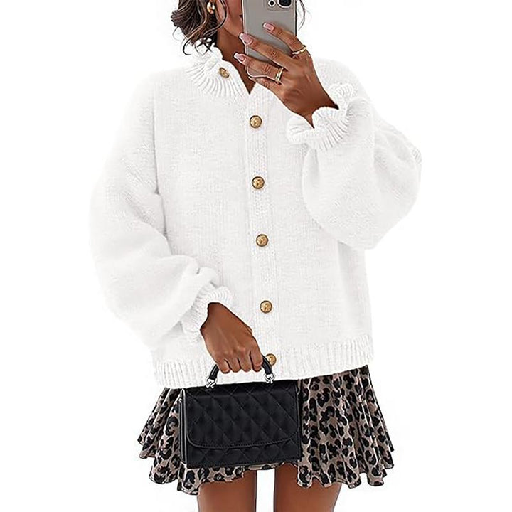 Versatile women's buttoned cardigan sweater. Relaxed fit, long sleeve, comfortable elegant knitwear top.