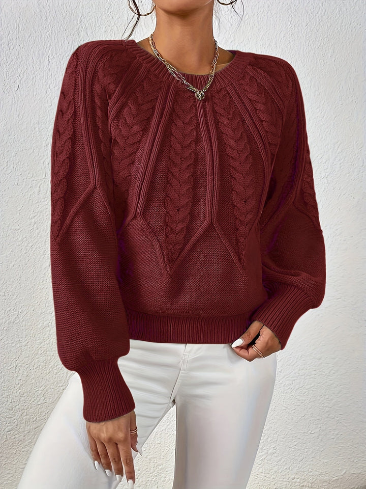 Women's relaxed fit cable knit sweater, featuring beautiful texture and voluminous lantern sleeves.