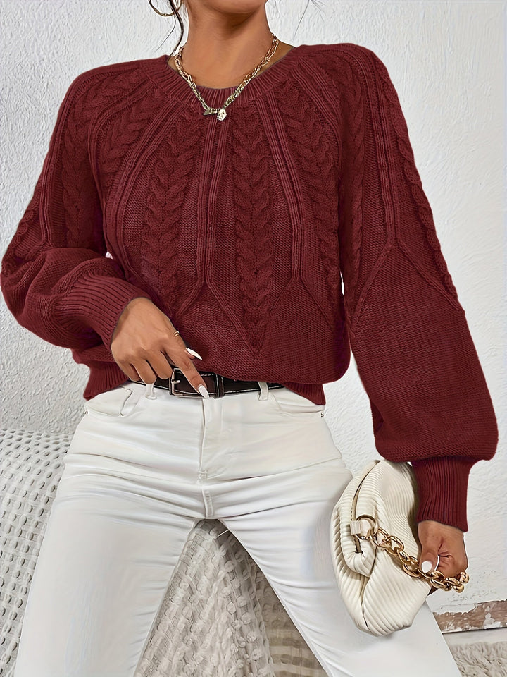 Cozy knitwear for women: cable knit sweater, relaxed fit, stylish lantern sleeves, perfect for layering.
