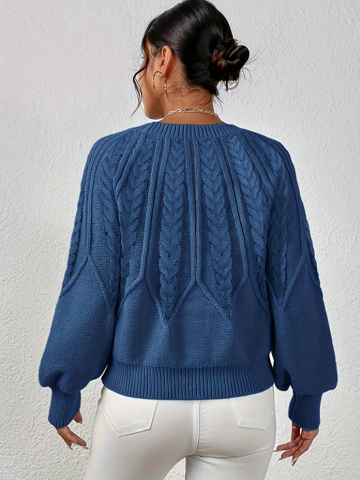Chic women's cable knit pullover with a relaxed fit and elegant lantern sleeves, versatile style.