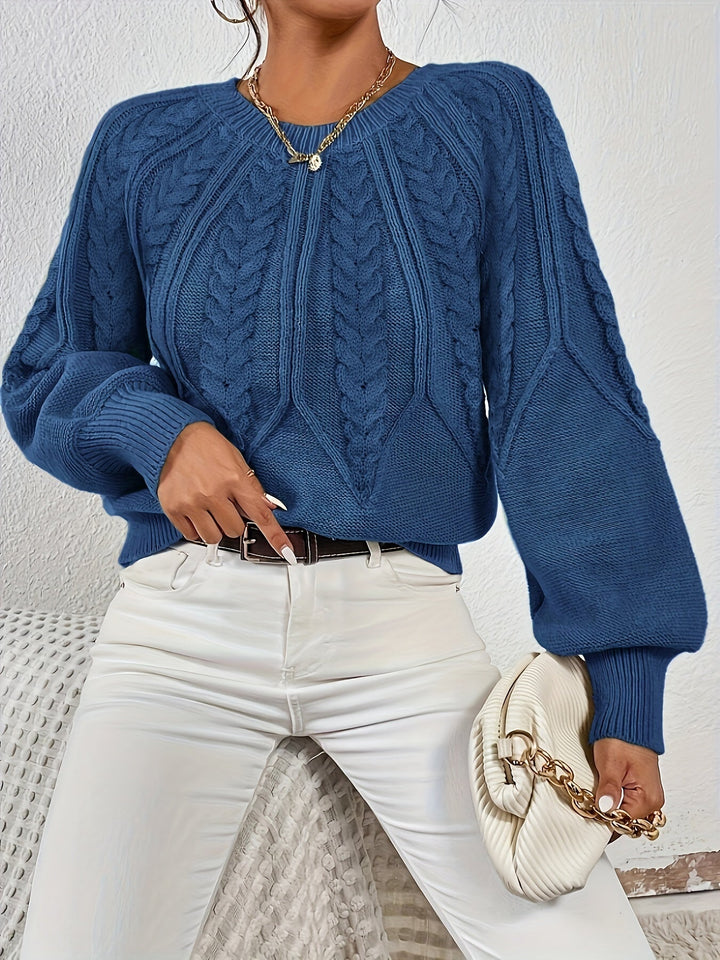 Classic cable knit women's sweater, relaxed fit, modern lantern sleeves, ideal for cooler weather.