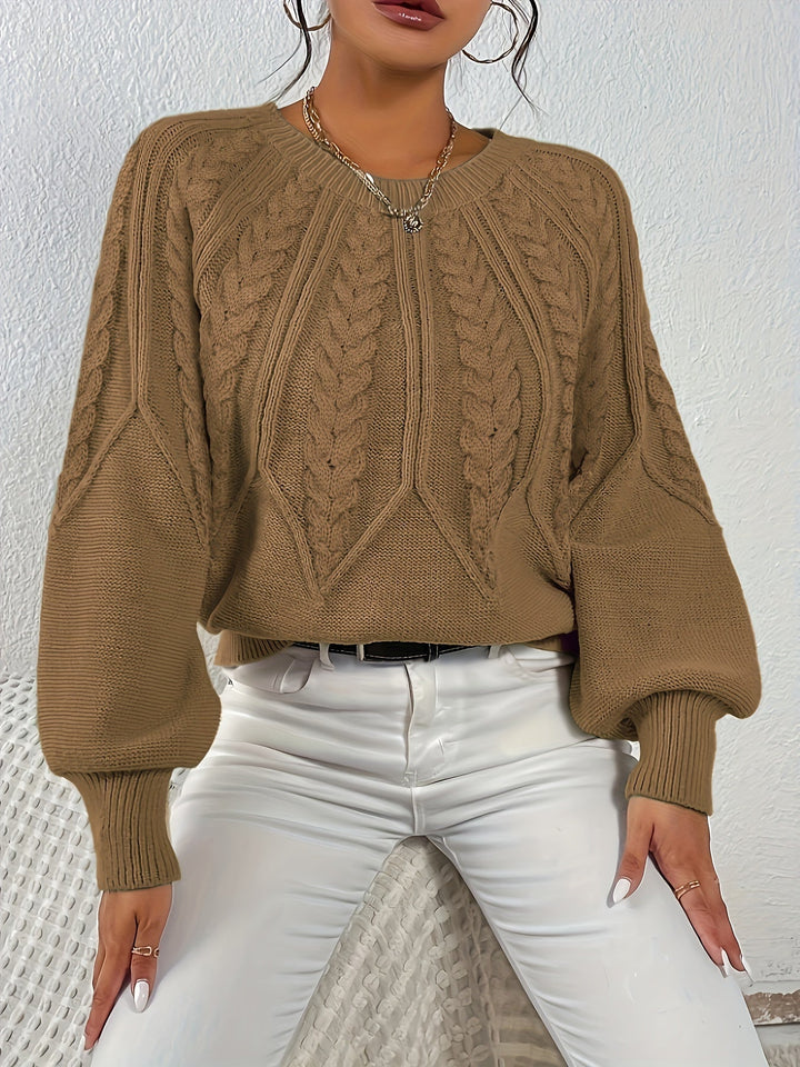 Women's chic cable knit sweater, relaxed fit, statement lantern sleeves, for a modern fall outfit.