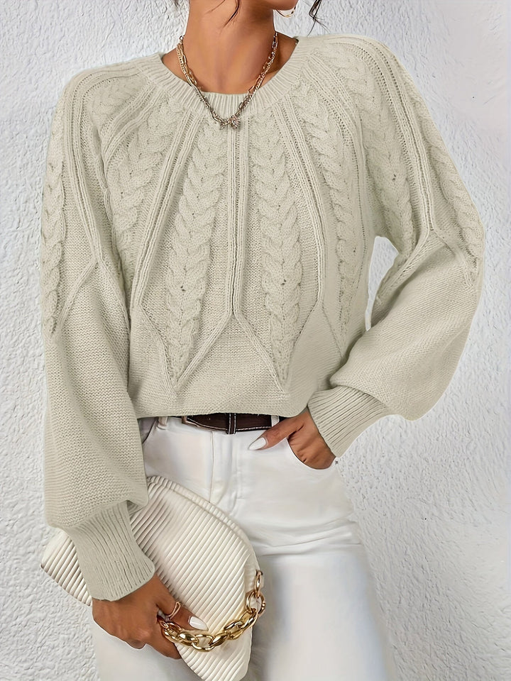 Relaxed fit women's cable knit top, featuring fashionable lantern sleeves; a cozy winter essential.