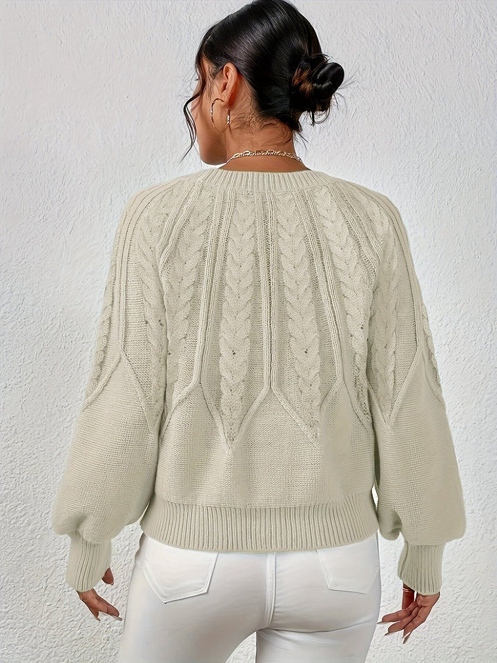 Fall fashion women's cable knit sweater, relaxed silhouette, and statement lantern sleeves.
