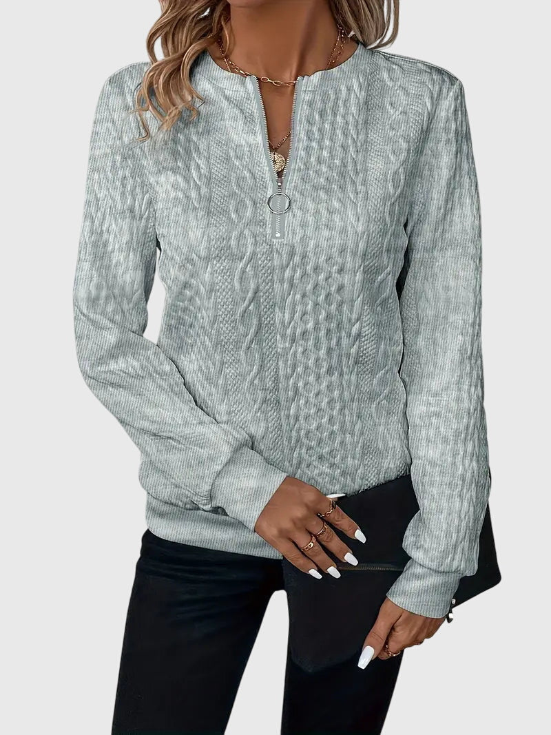 Stylish women's quarter-zip sweater, textured cable pattern, casual fit.