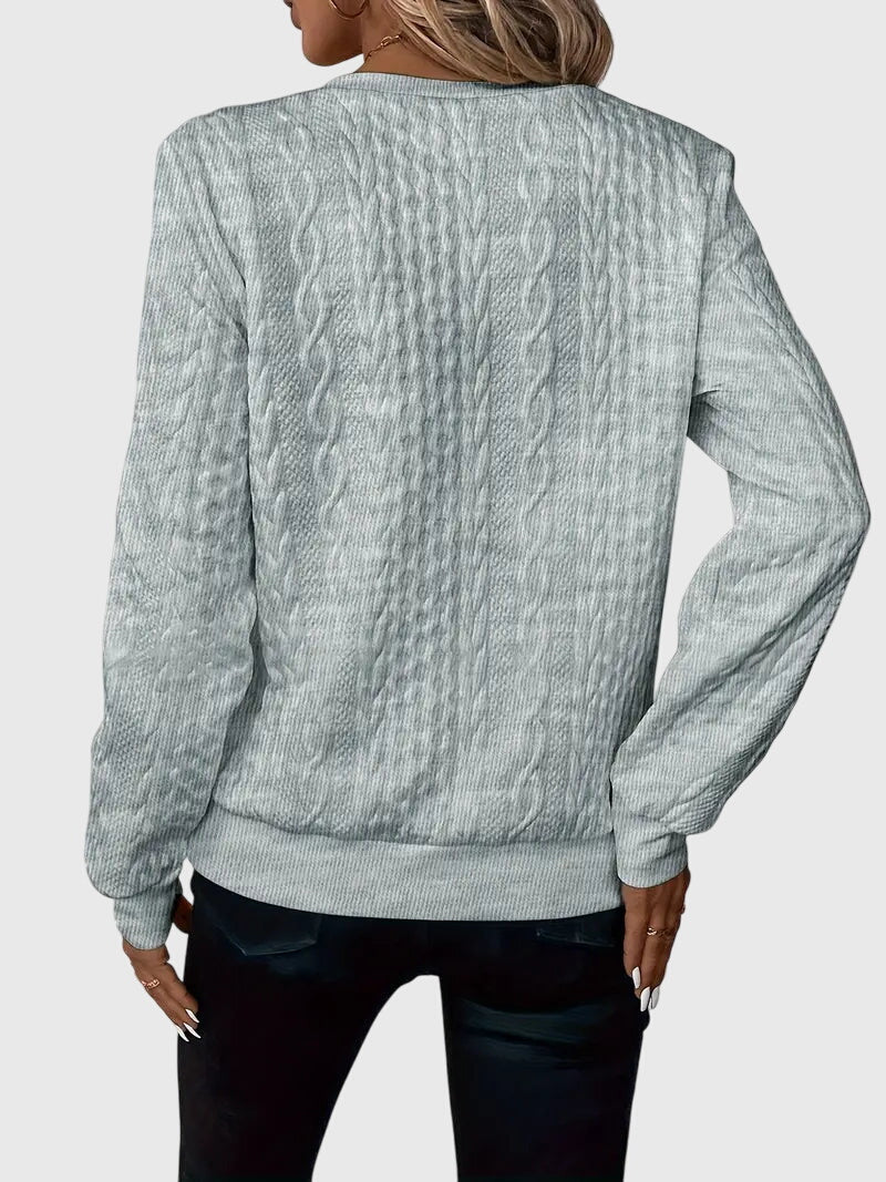 Women's cozy quarter-zip sweater with beautiful cable knit details.