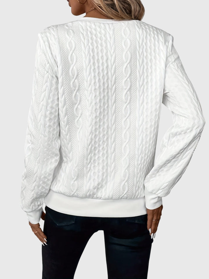 Textured women's cable knit quarter-zip pullover, long sleeve comfort.