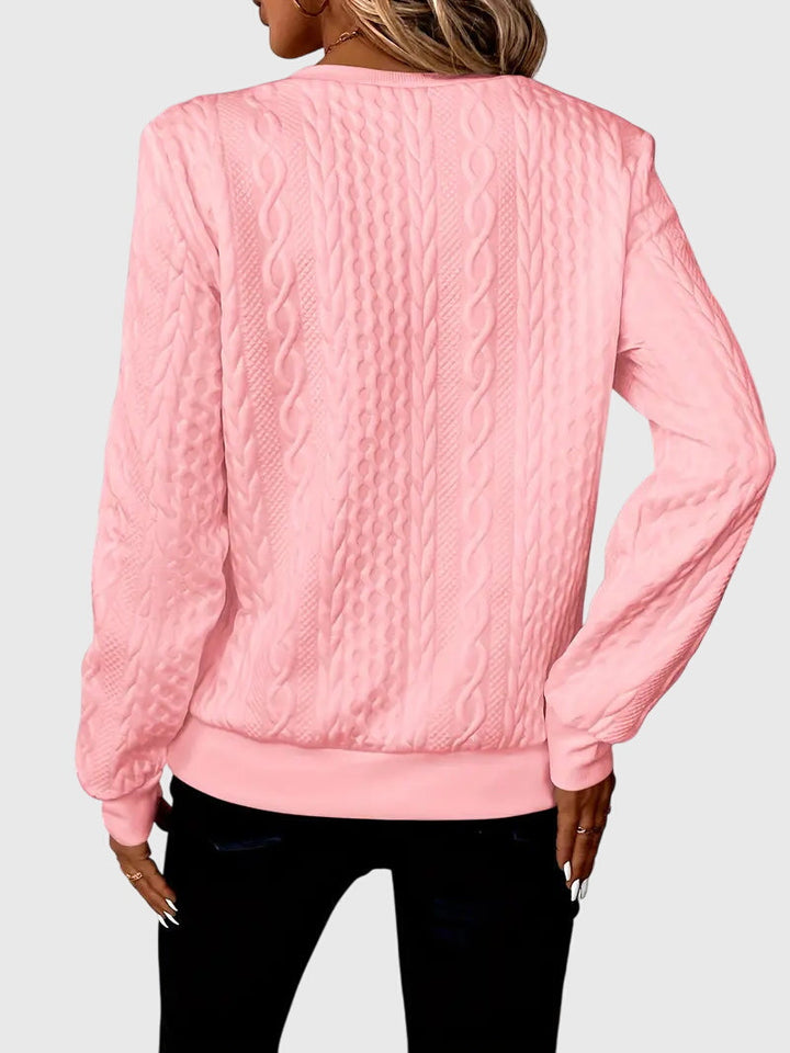 Casual women's cable pattern quarter-zip, perfect for cool weather.