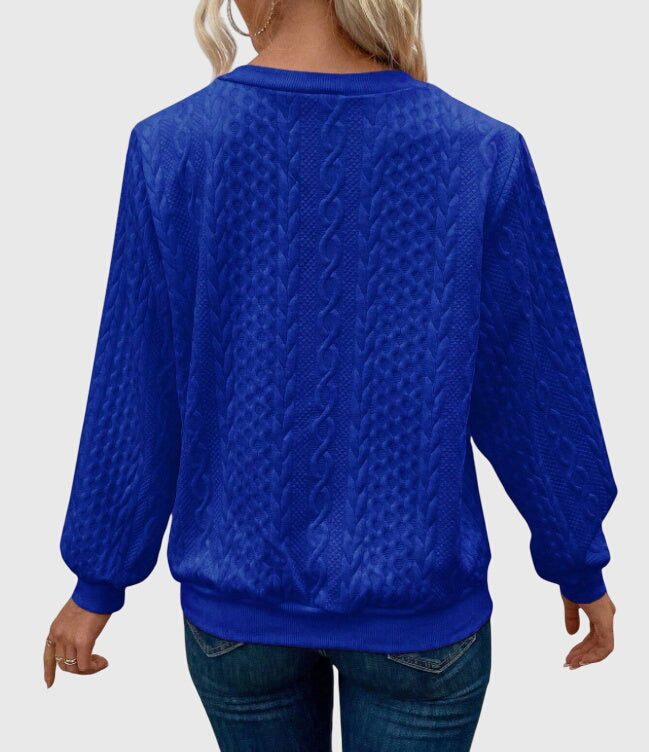 Sophisticated women's cable knit quarter-zip, timeless design.