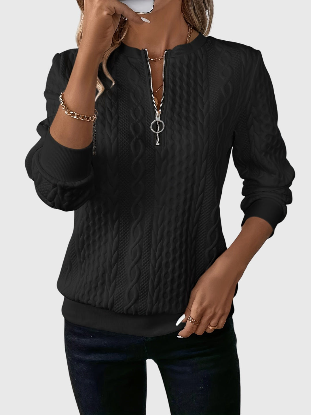 Versatile women's cable pattern quarter-zip pullover for autumn.