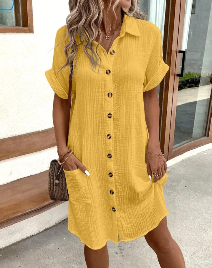 Modern women's mini shirt dress featuring button-down front & classic collar. A chic casual summer dress.