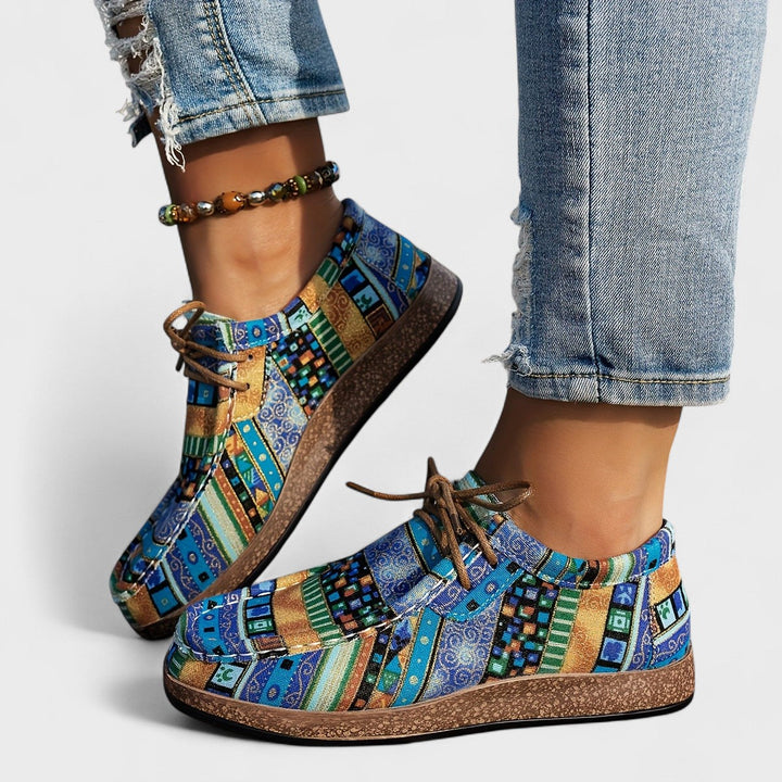 Everyday women's sneakers designed for comfort & stability, featuring a wide heel & slip-on convenience.