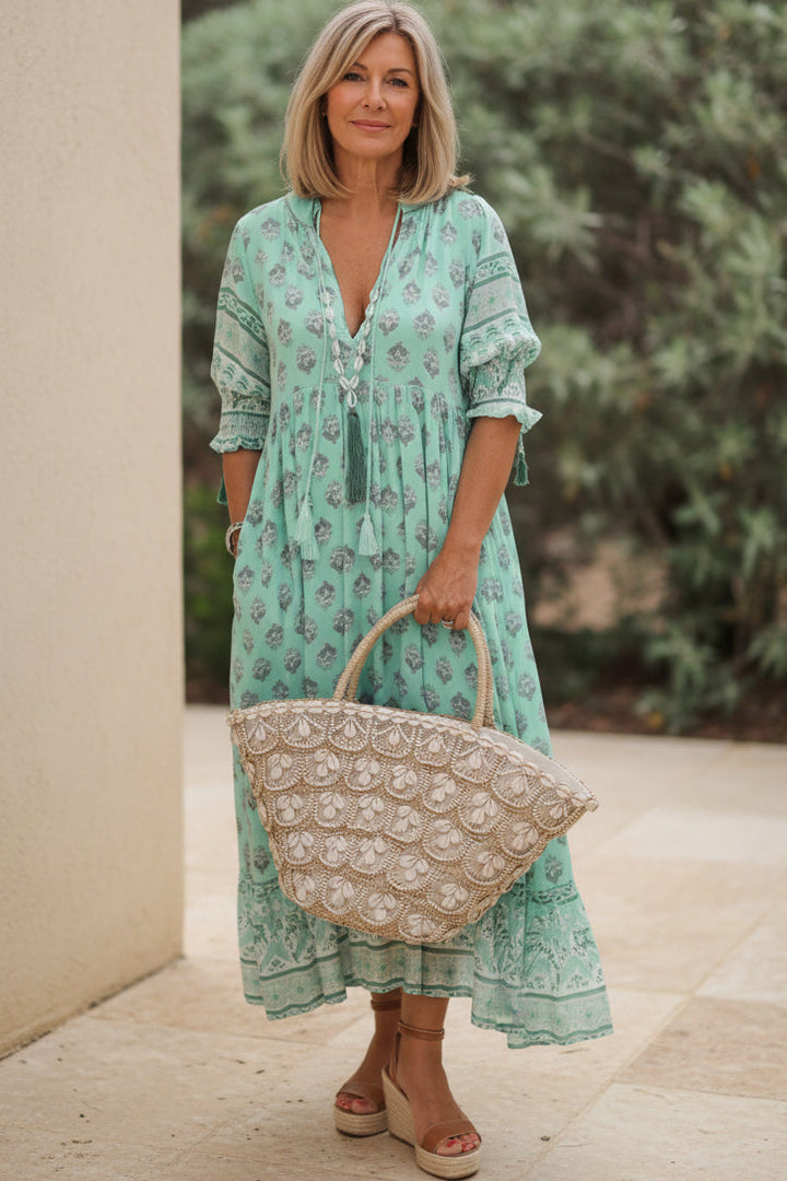 Elegant women's half-sleeve V-neck dress with a unique all-over print. A comfortable and versatile midi for everyday.