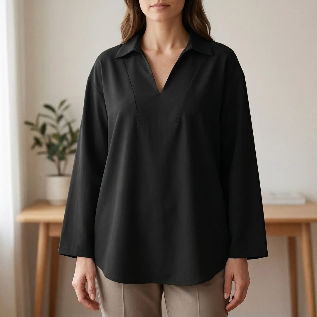 Women's casual high-low tunic top with long sleeves. Loose fit everyday blouse, versatile for smart casual wear.