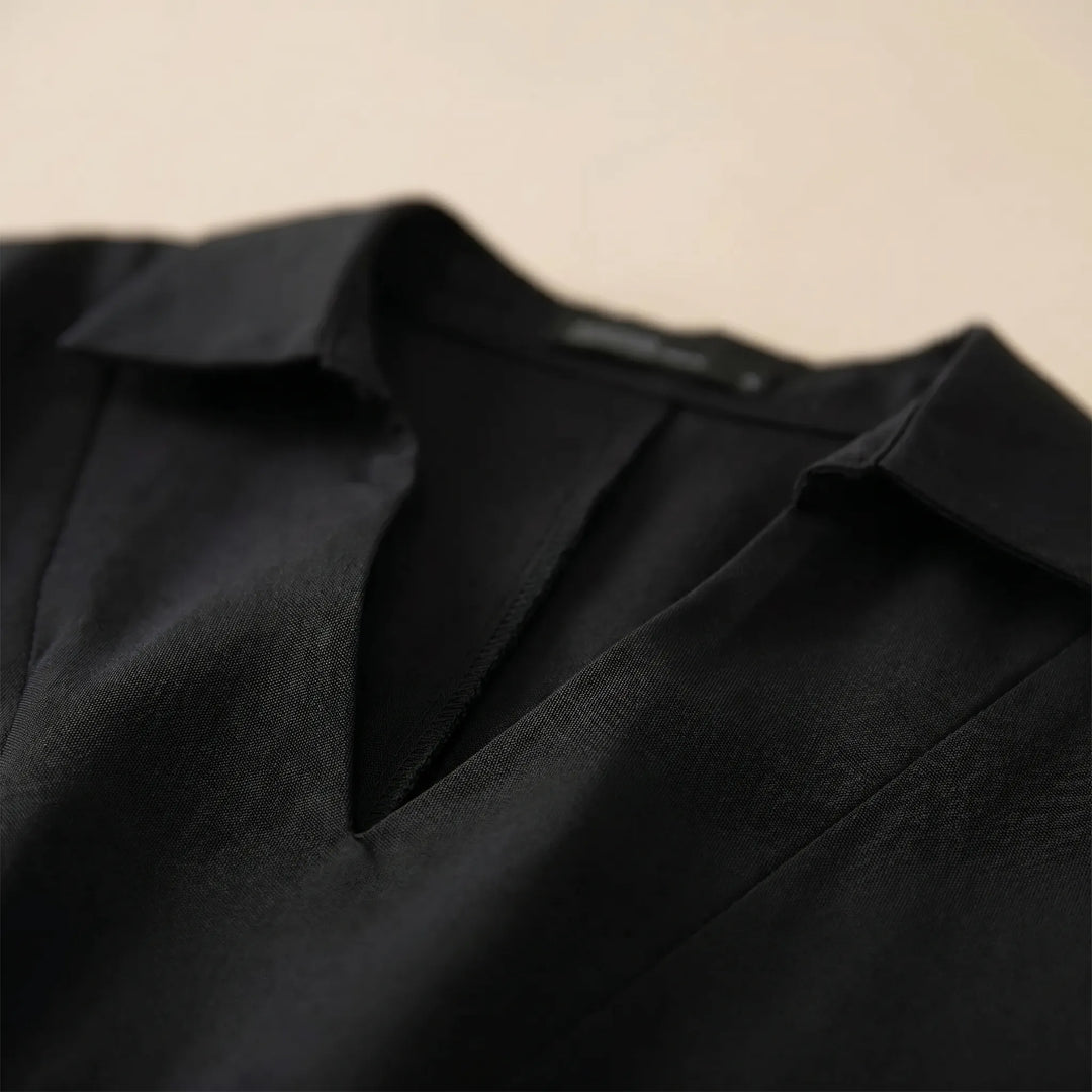 Effortless women's casual high-low tunic. Loose fit, long sleeve blouse for comfortable and versatile everyday wear.