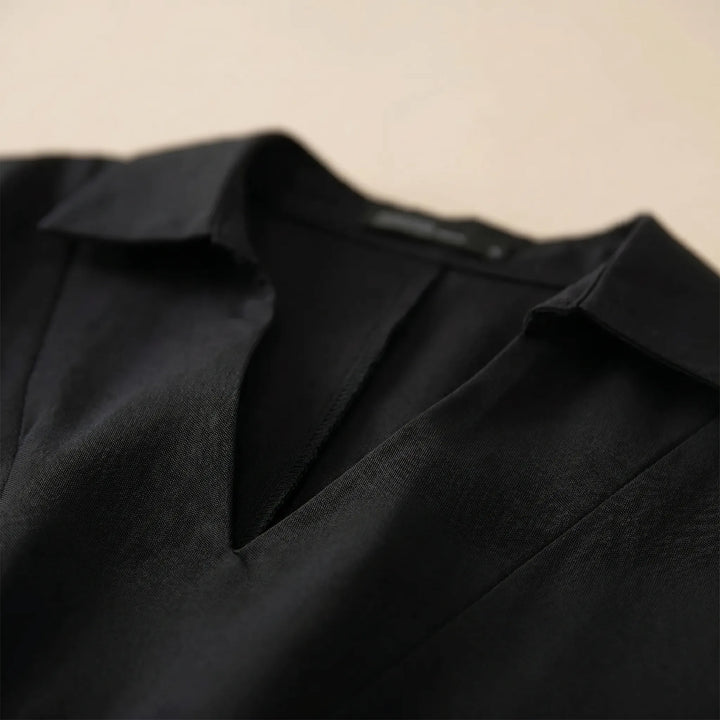 Effortless women's casual high-low tunic. Loose fit, long sleeve blouse for comfortable and versatile everyday wear.