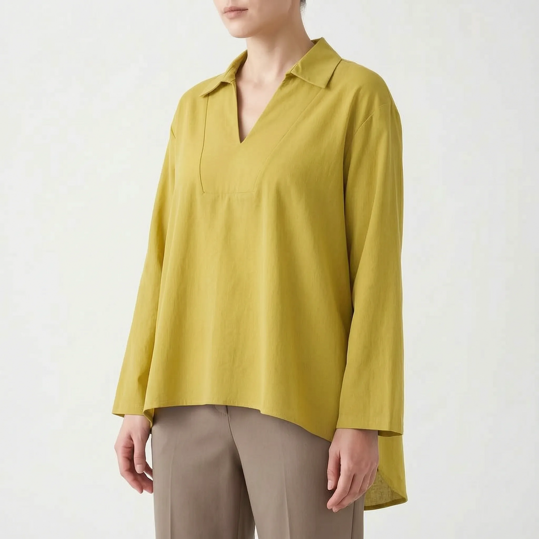 Women's solid color high-low tunic top. Smart casual long sleeve blouse with a v-neck, ideal for versatile styling.