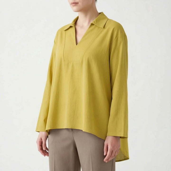 Women's solid color high-low tunic top. Smart casual long sleeve blouse with a v-neck, ideal for versatile styling.