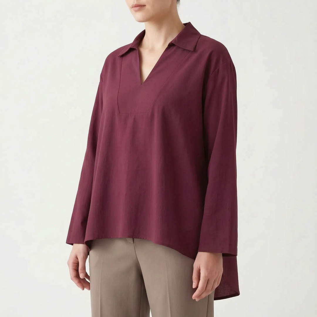 Casual women's high-low tunic blouse. Long sleeve, loose fit top for effortless everyday style and comfort.